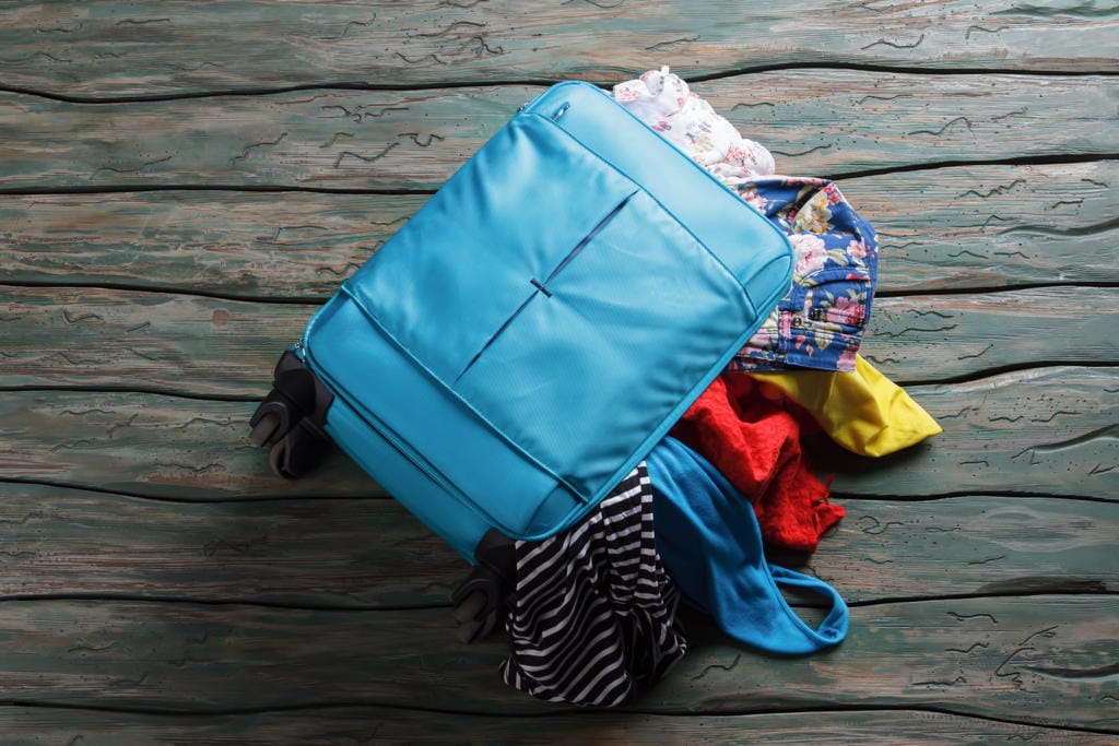 luggage-bag-filled-with-clothes-2023-11-27-04-59-08-utc